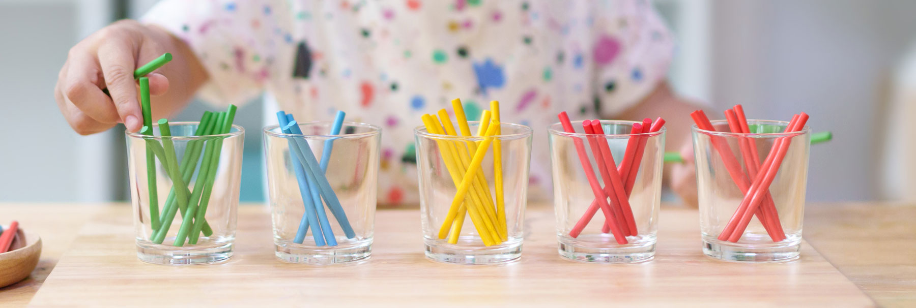child sorting crayons