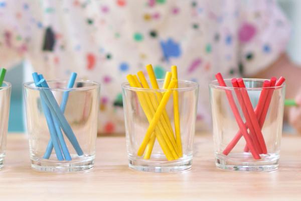 child sorting crayons